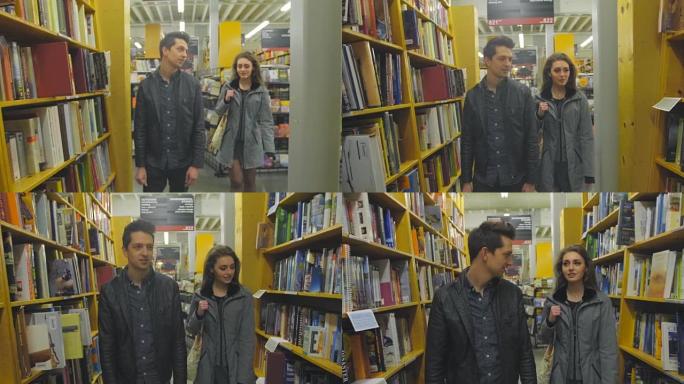 迷人的夫妇走在书店的过道上