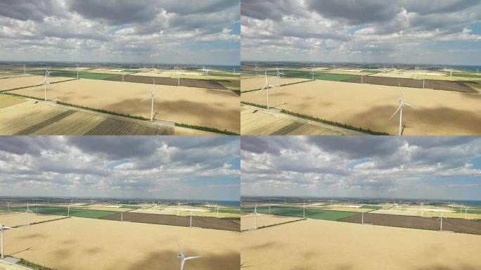 蓝天下农田背景下的农村风电场。航空测量