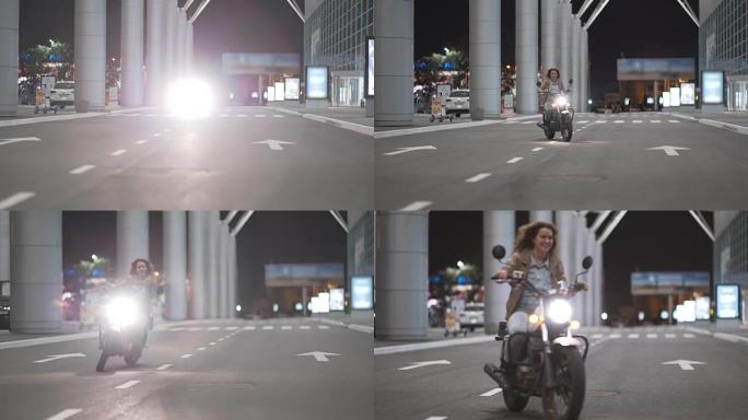两个漂亮的年轻女子晚上在城市街道上骑着摩托车，互相交谈。女骑自行车的人和他的女朋友