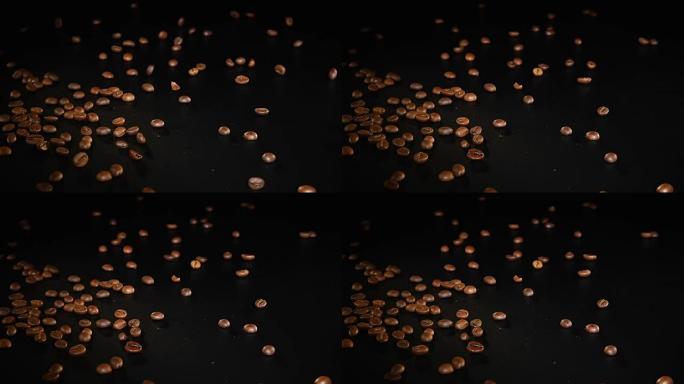 咖啡豆-掉落。以96 FpS的速度拍摄咖啡豆落在黑色表面上。任何咖啡相关主题或标题背景的漂亮通用镜头