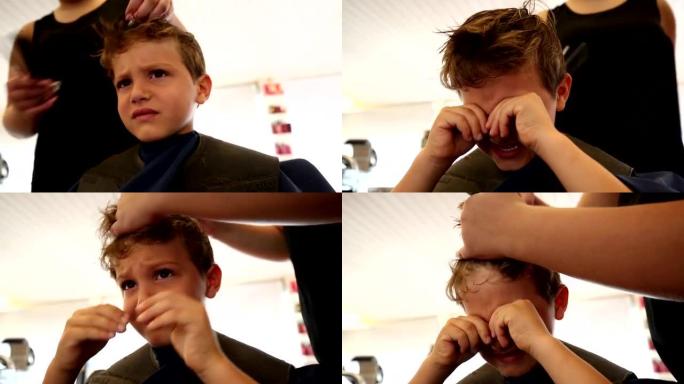 小男孩在理发店理发。孩子理发