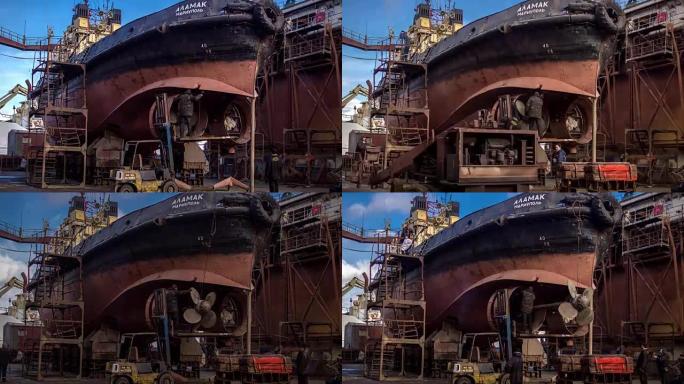 工人在船厂的浮船坞修理旧船。船舶螺旋桨改造。渔船焊接延时全高清视频