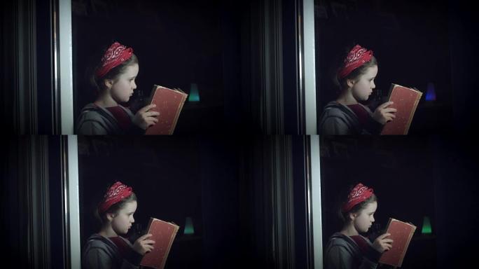 4k可爱的孩子在窗户玻璃阅读本