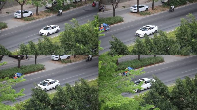 行驶在马路上的白色日产轩逸小轿车