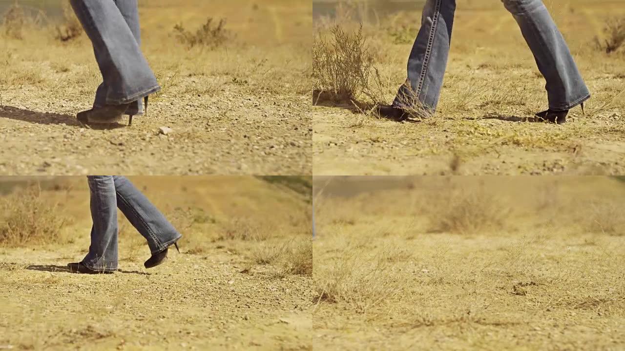走在沙漠中的女人。西式风格。在红色史诗龙数码电影相机上拍摄，配有超定焦镜头。
