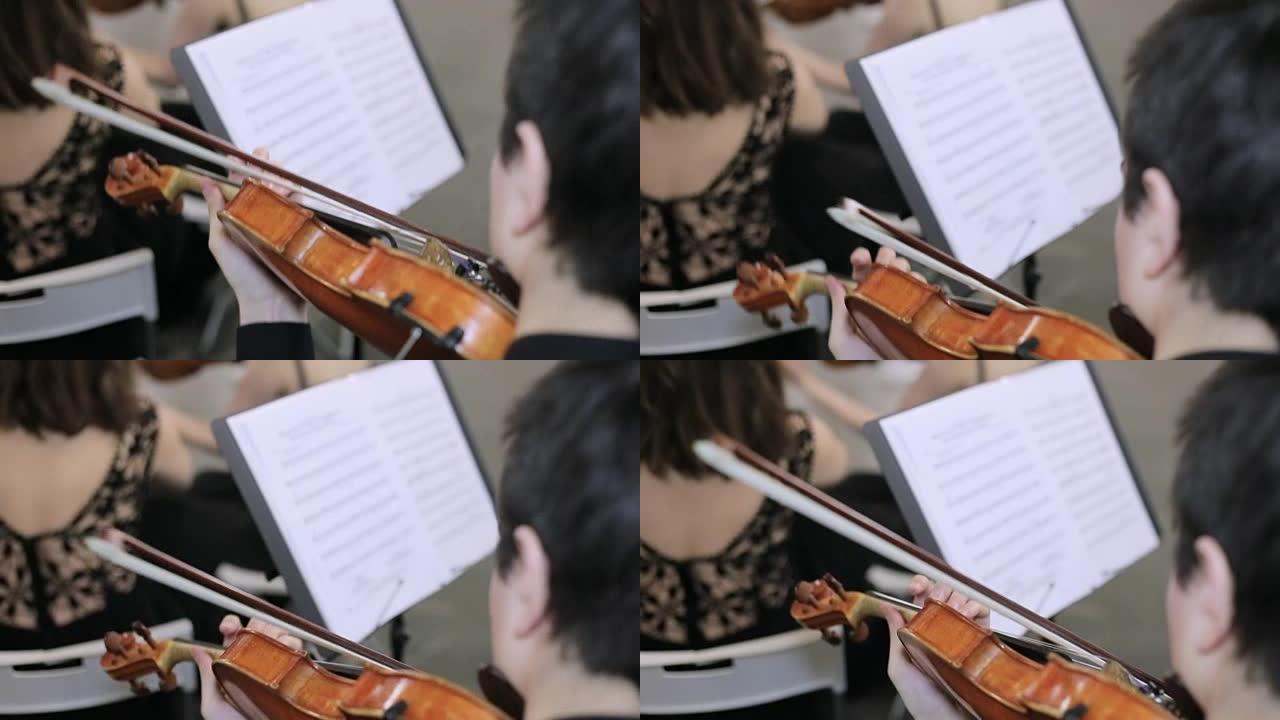 音乐家演奏小提琴的特写，经典音乐