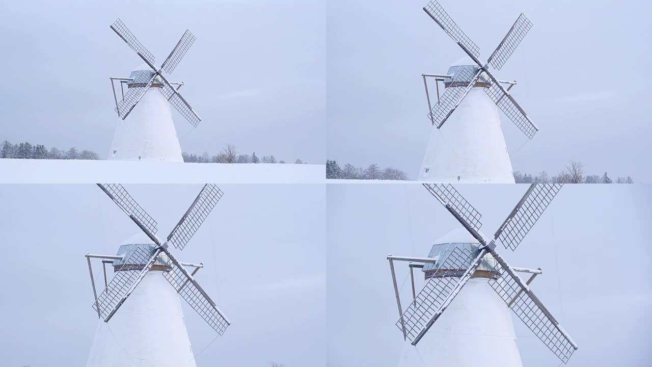 放大雪地旧风车的视野