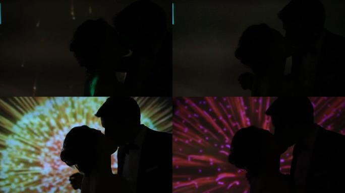烟花背景下的情侣接吻剪影