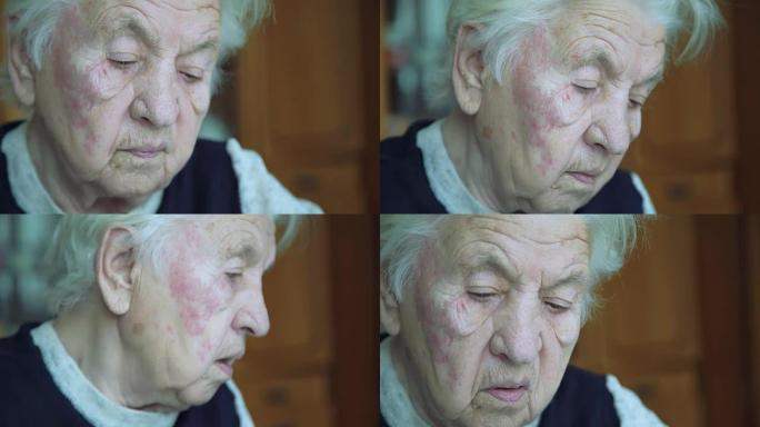 老皱纹疲倦的祖母独自看着并对着镜头说的肖像