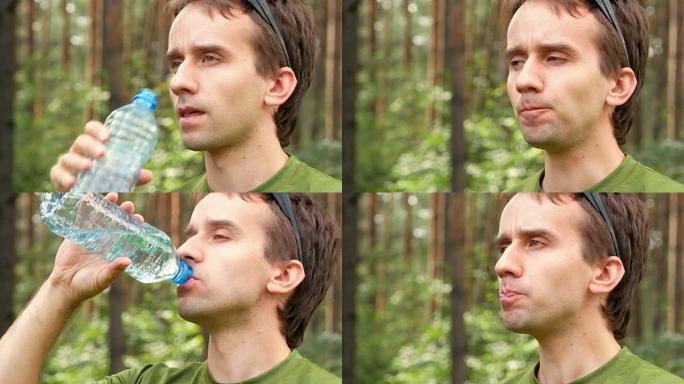 年轻的男性自行车手从瓶子里喝水。绿色t恤，特写