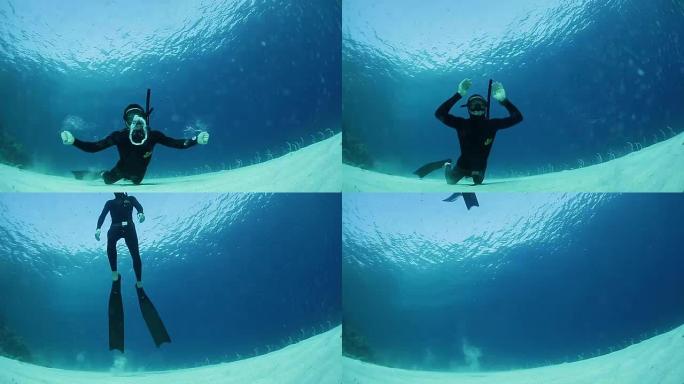 自由潜水员在水下制造环形气泡