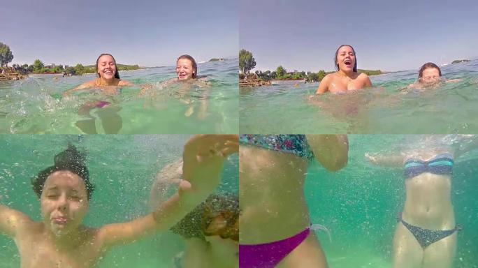 朋友青少年在水下潜水的海滩上玩得开心，慢动作股票视频