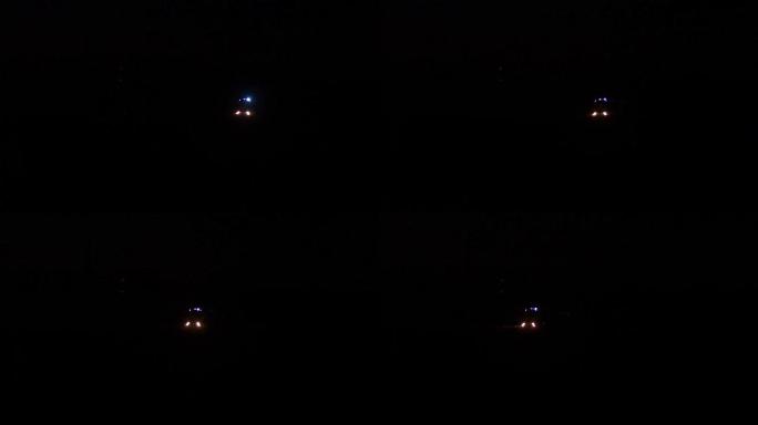 汽车救援人员卡车在夜间闪烁蓝灯，消防车沿着道路行驶，灯亮着，警笛声