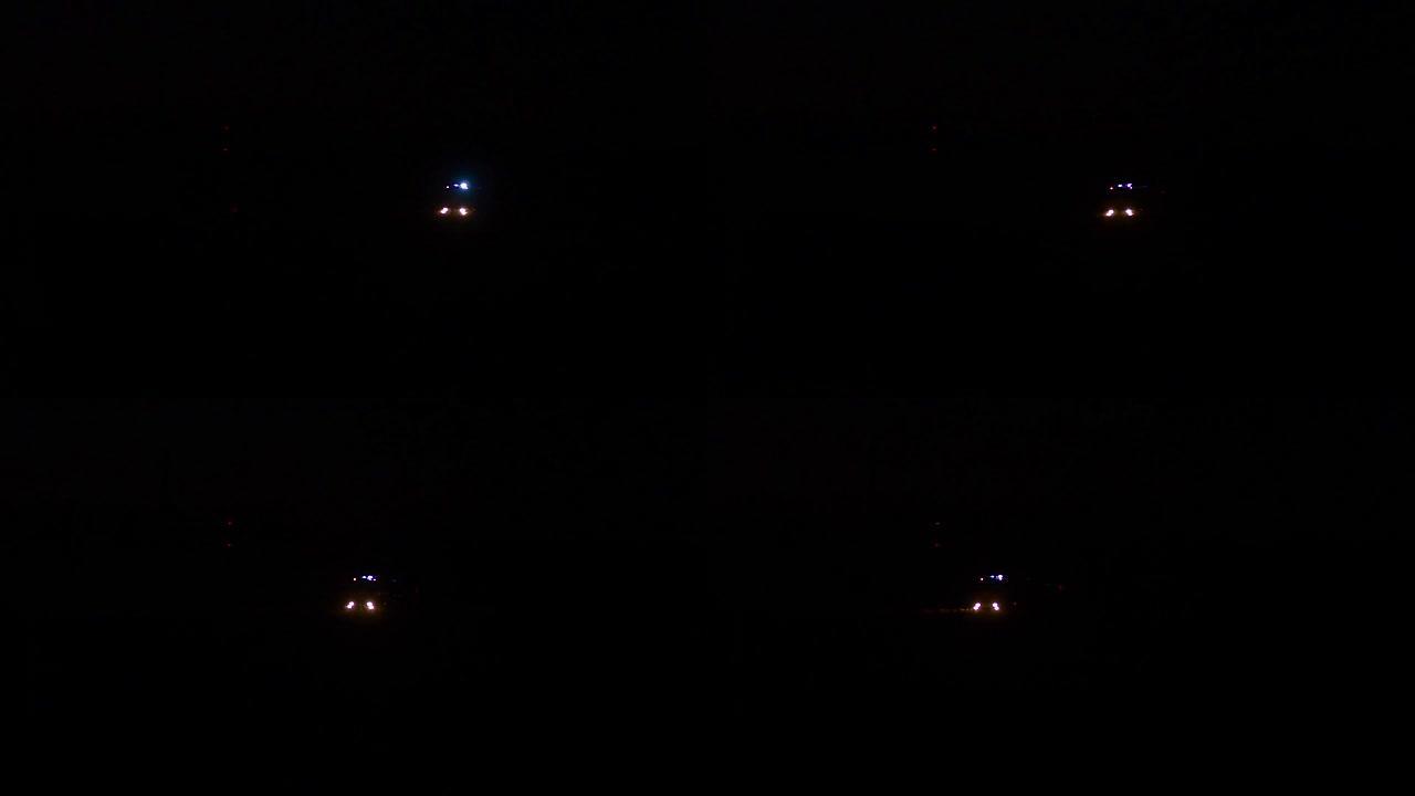 汽车救援人员卡车在夜间闪烁蓝灯，消防车沿着道路行驶，灯亮着，警笛声