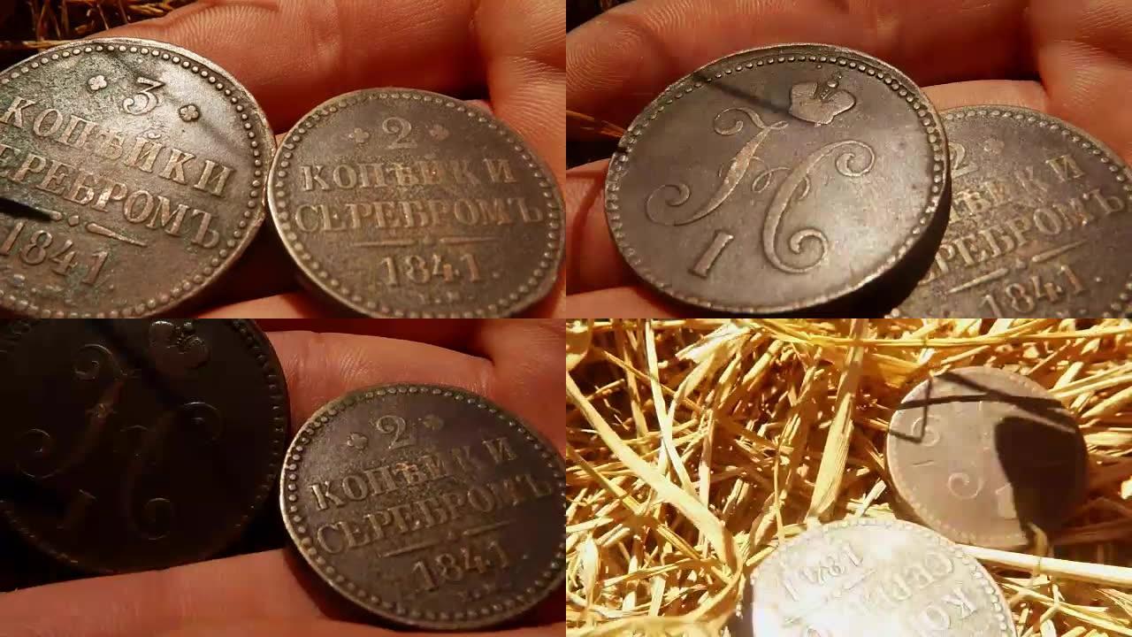 面值二和三戈比老俄罗斯沙皇铜币在手掌上放它在Hay宏