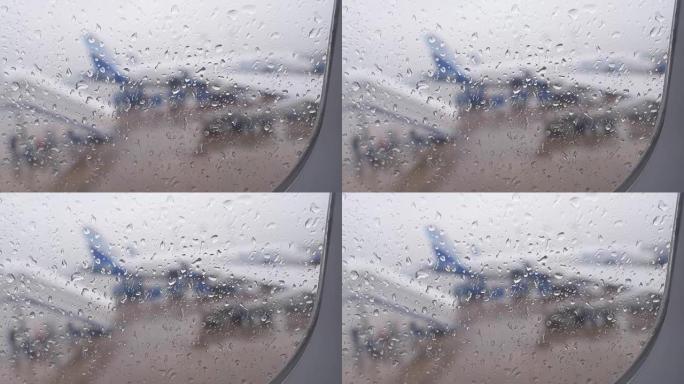 从机场降落时，飞机窗户上的雨滴