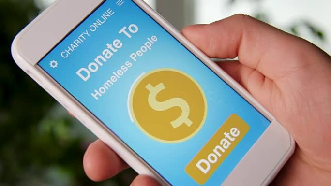 男子使用智能手机上的慈善应用程序向无家可归的人进行在线捐赠