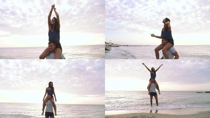 快乐的年轻夫妇在日落时在海滩上玩得开心，慢动作