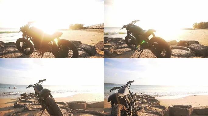 日落期间海滩上的摩托车