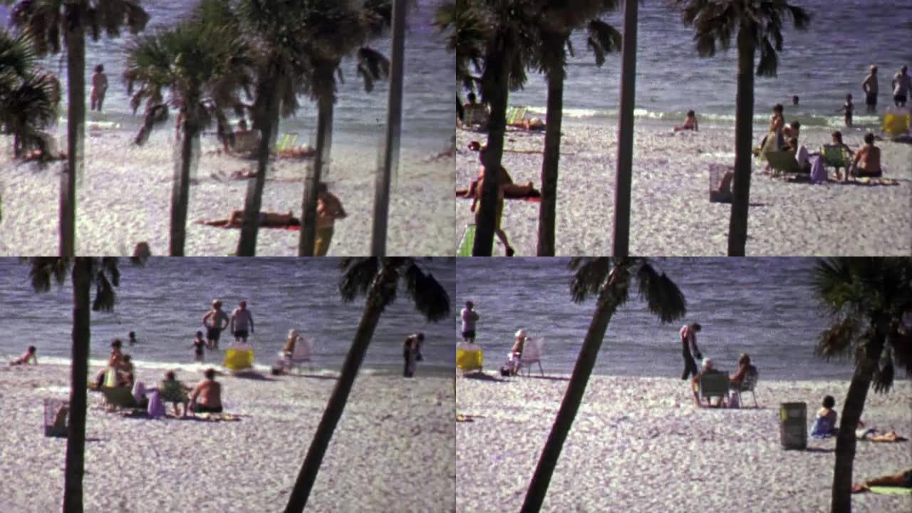 1967年的今天，游客们在白色的沙滩上悠闲地享受棕榈树。