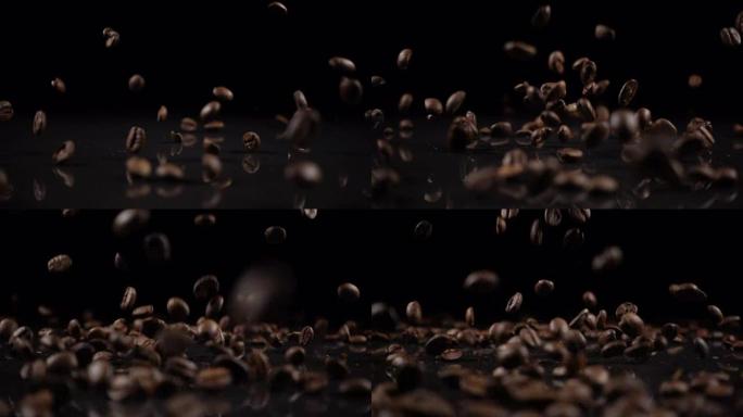 咖啡豆落在坚实的黑色表面上