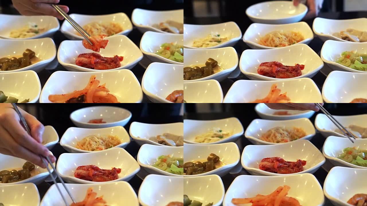 传统的韩国配菜食物用筷子吃，菜单很多