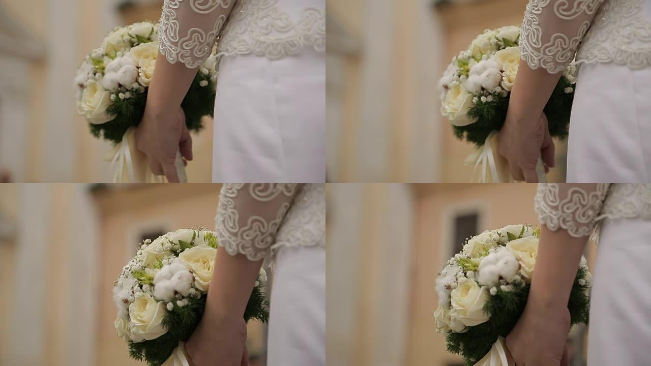 新娘手中的美丽婚礼花束