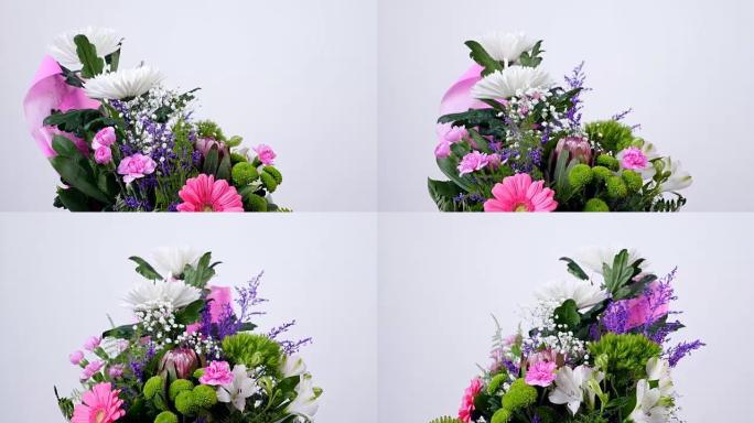 花朵，花束，白色背景上的旋转，花卉组成由菊花，满天星，一枝黄花，Barbatus，Protea，康乃