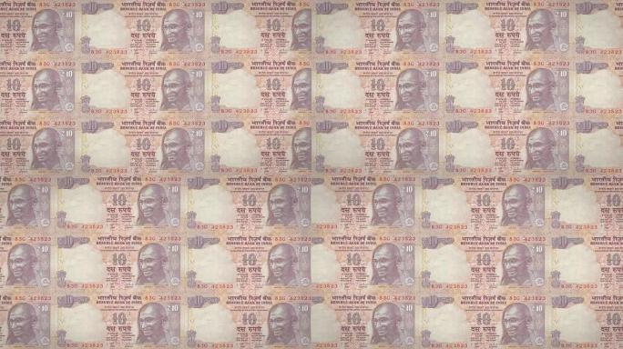 印度滚动的十印度卢比纸币，现金，循环