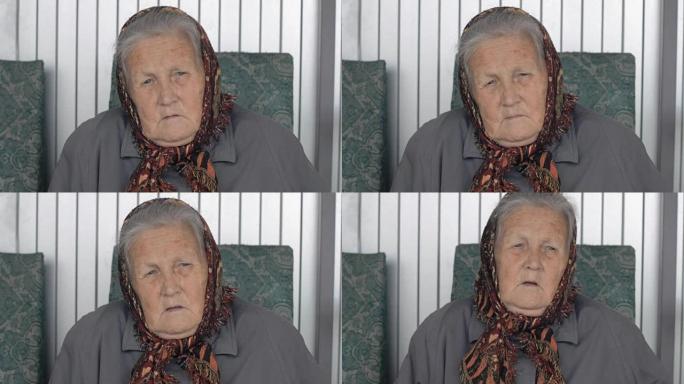 一个穿着棕色方巾的老妇人的特写肖像