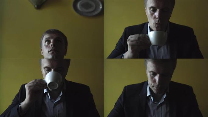 年轻英俊的男人喝咖啡