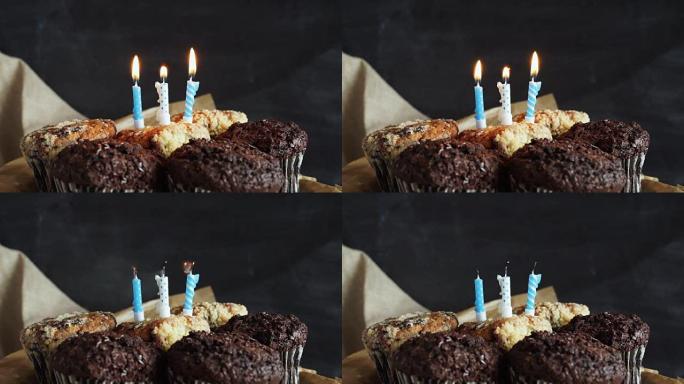 灰色背景上的美味生日蛋糕蜡烛