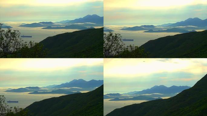 香港海洋湾的天堂抽象景观。带着金光的日落，山的阴影和可以