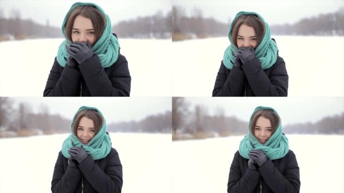 她在冬天站在雪地里温暖他的手。全高清视频