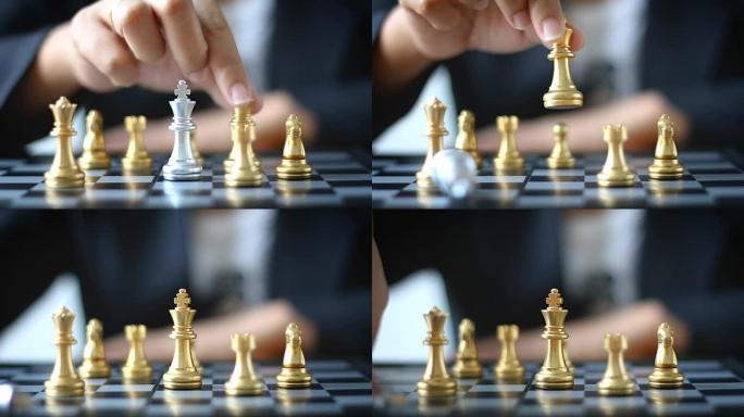 近距离射击的商业女人移动金棋手击败了一个银王棋在白和黑棋盘上的商业挑战竞争赢家和输家的概念