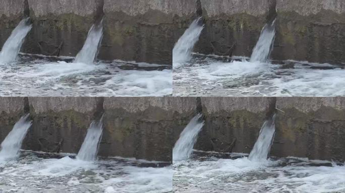 大坝是一座大量涌水的大坝。当水从高处落下时。水流入井中的巨大压力