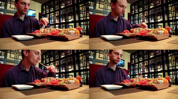 男子在日本餐厅吃寿司