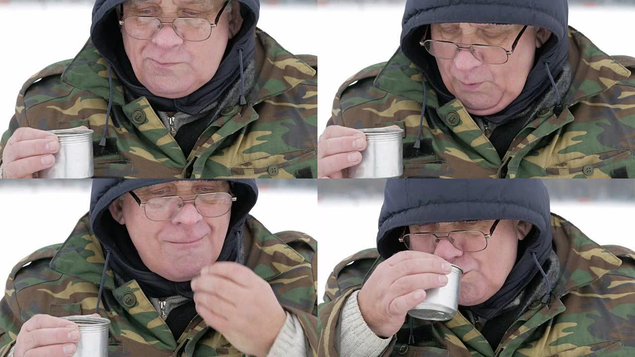 冬天，一个人在湖上钓鱼，用热水瓶喝茶。他用热饮吃饼干
