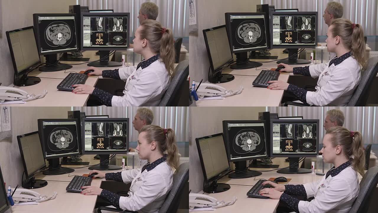 年轻医生在电脑上打字的侧视图