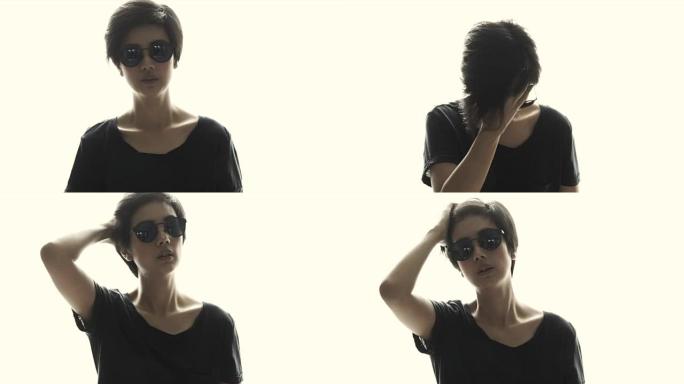 亚洲短发酷女孩戴着太阳镜在白色孤立背景