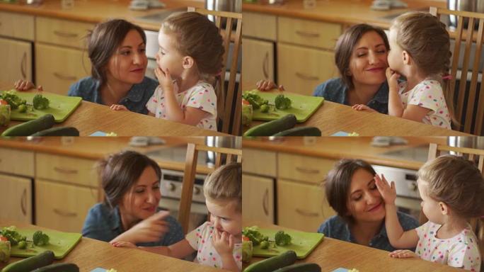 小女儿感谢妈妈吃饭。她亲吻并用手抚摸她的脸。谢谢。儿童教育。女儿的爱。父母和孩子的相互关系。