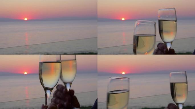 希腊比雷埃夫斯日落海碰杯香槟