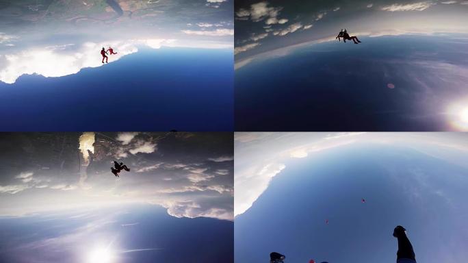 两个跳伞运动员在多云的天空中一起跳舞。晴天。极限运动。特技