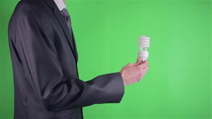 商人创意灯泡在色度键或绿色屏幕上