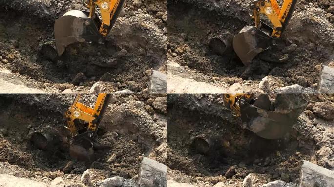 挖掘机铲斗在运动中。