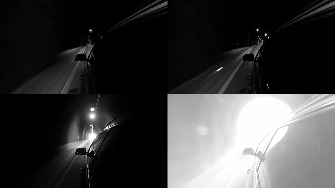 4k黑白镜头，一辆汽车穿过隧道面对末端明亮的白光