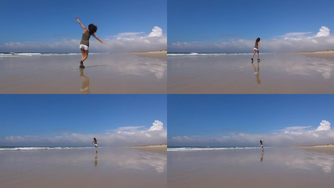 在海滩上飞翔的背部女人