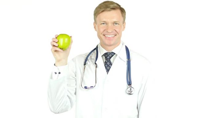健康的重要性。医生展示绿苹果