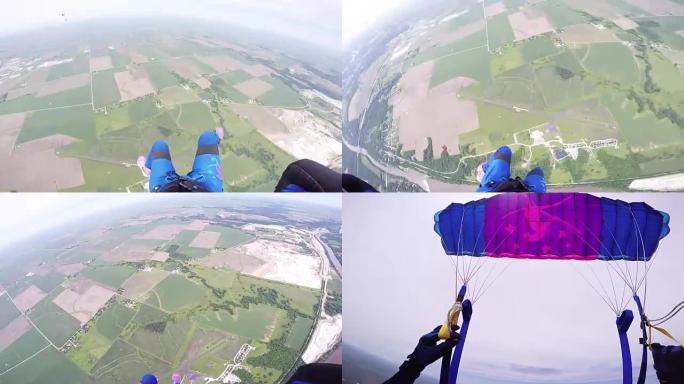 专业跳伞运动员在天空中打开降落伞。飞越绿色平地。阴云密布