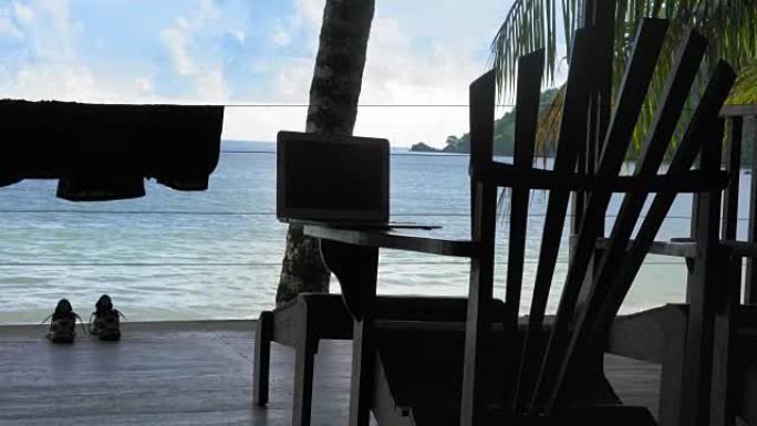 特立尼达和多巴哥旅游胜地阿迪朗达克椅子上的笔记本电脑